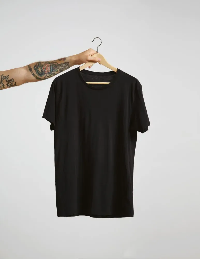 tattooed biker hand holds hang with blank black t shirt from premium thin cotton isolated on white 1000x1000 1 jpg webp tattooed biker hand holds hang with blank black t shirt from premium thin cotton isolated on white 1000x1000 1 jpg webp