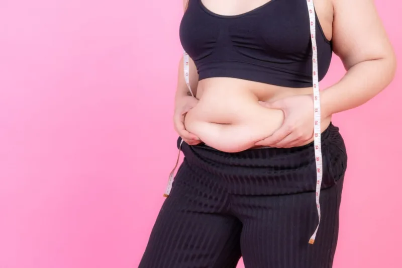 overweight squeeze belly fat with measure tape on her neck 1 overweight squeeze belly fat with measure tape on her neck 1